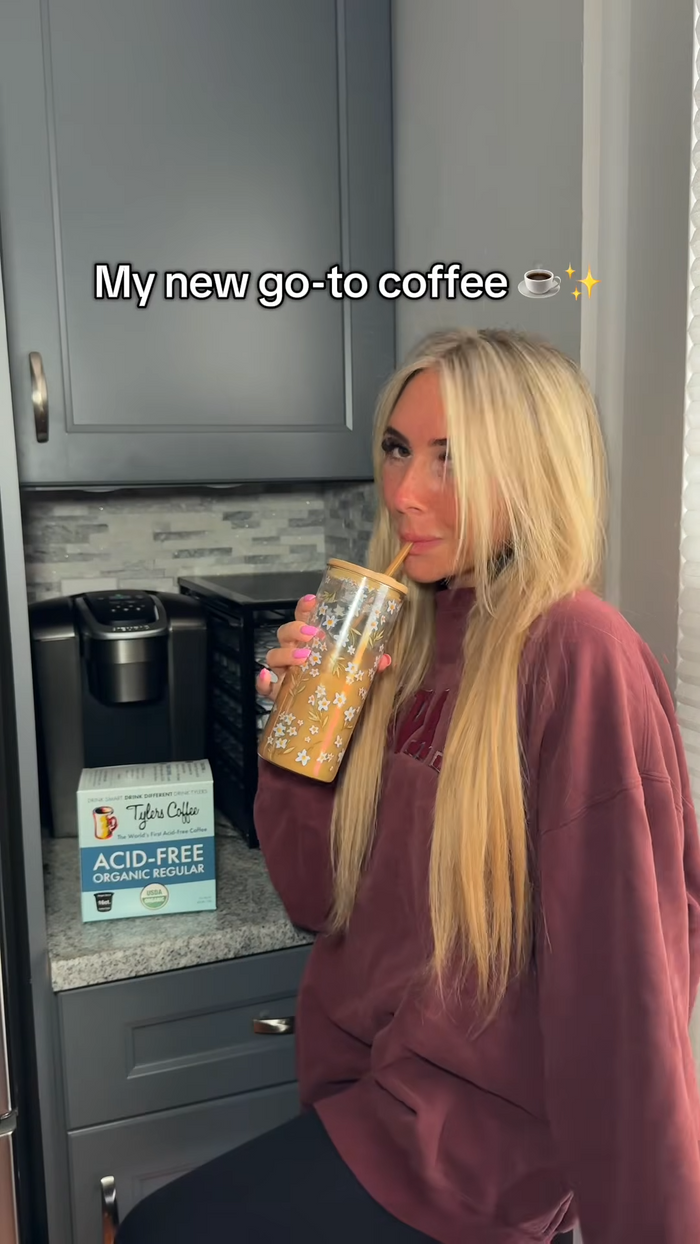 Customer holding Tylers Coffees